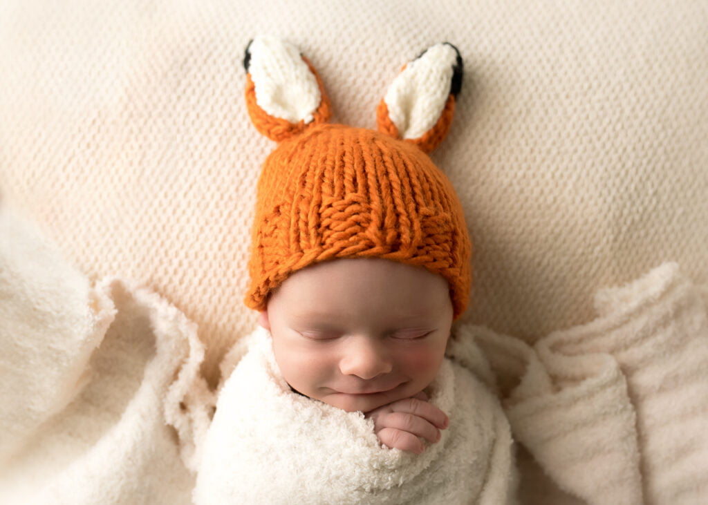 baby in fox hat