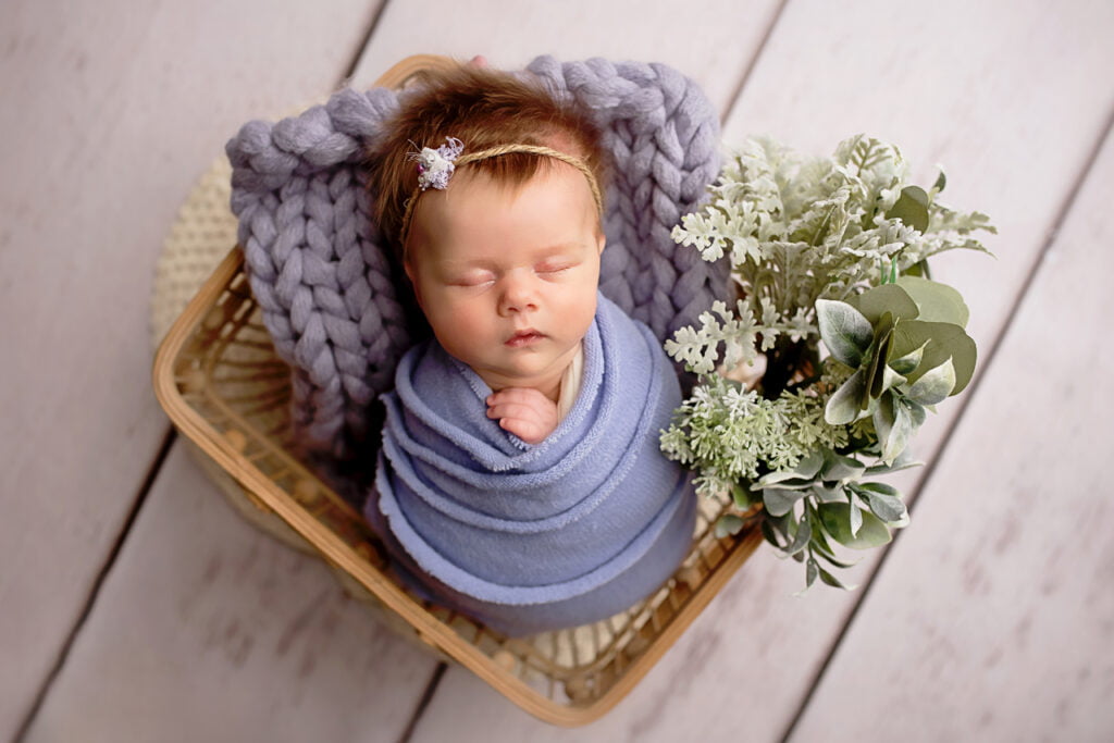 newborn in basket